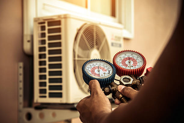 Professional Air Conditioning Service technician working in Kimball, TN